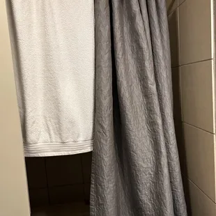 The persons towels and stuff from the first room I was checked into