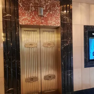 Art Deco elevator doors with Marble surround and floor