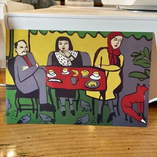 three people sitting at a table