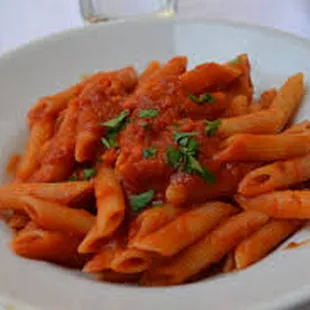 a plate of penne with tomato sauce