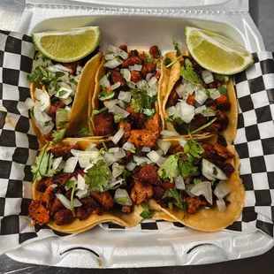 three tacoss in a styrofoam container