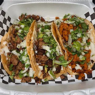 three tacoss in a styrofoam container