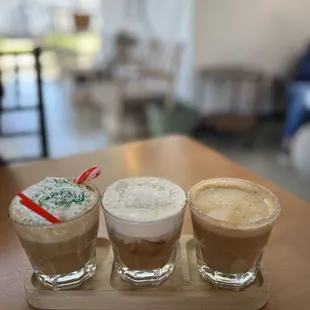 December coffee flight: Honey latte, Coconut cold brew with caramel cold foam,Classic peppermint bark latte