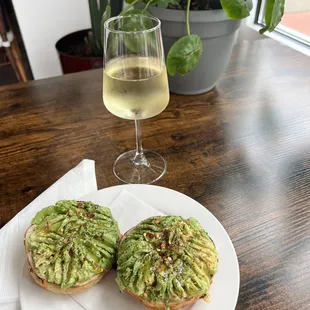 House made jalapeño cheddar bagel, avocado, salt &amp; pepper, crushed red pepper, &amp; a honey drizzle + sauv blanc