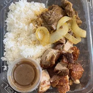 2 item plate with rice, bistek, and lechon kawali