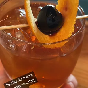 Delicious Old Fashioned  cocktail with luxardo cherries.