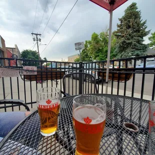 two glasses of beer on a table