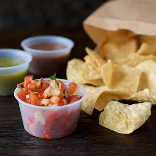 a bowl of salsa and chips