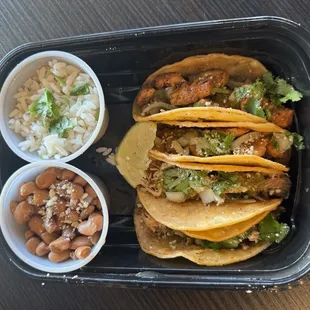 Street tacos with beans and rice.