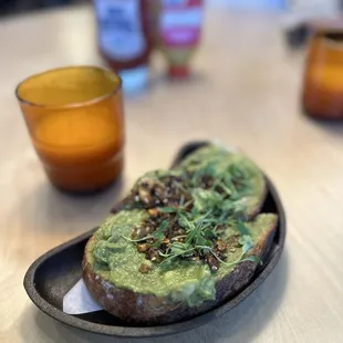 Avocado toast + 1/2 filled orange juice. $4. Looked like some waiter drank half of it behind the counter.