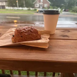 Breakfast croissant with ham and cheese and a 6 oz flat white