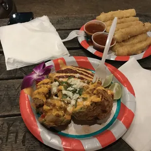 two plates of food on a picnic table