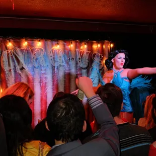 a woman in a blue dress on stage