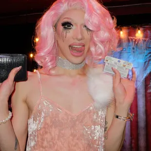 a woman with pink hair and a pink wig