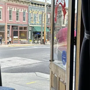 a view of a street through a door