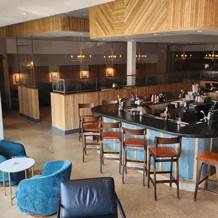 a bar with chairs and tables