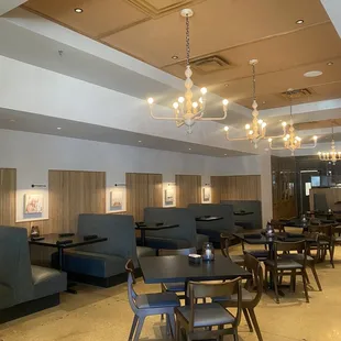 a dining area with tables and chairs