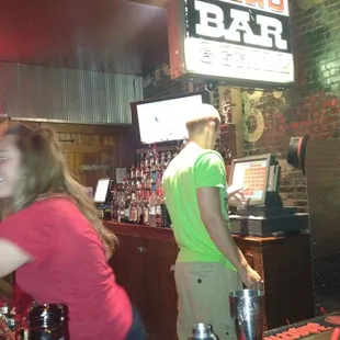 a man and a woman at a bar