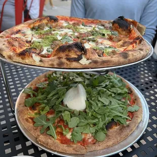 Pizza 2 for $29 on Tuesdays. Bottom is Fancy Nancy plus arugula added. Top is custom toppings