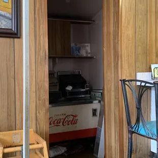 a coke machine in the kitchen