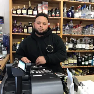 a man behind a cash register