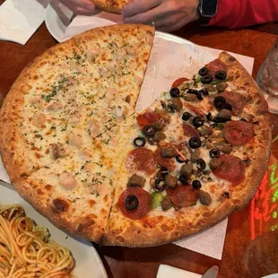 Half Fettuccine Alfredo and half Reno's Supreme Pizza