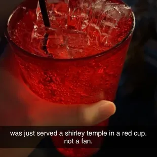 Shirley temple in a red cup with no maraschino cherries