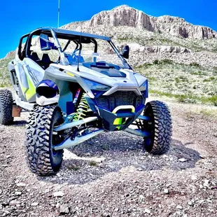One of our RZR's in front of Boulder Hill