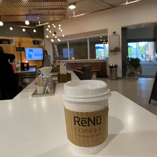 a cup of coffee on a counter