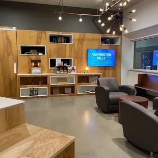 a coffee lounge with a flat screen tv