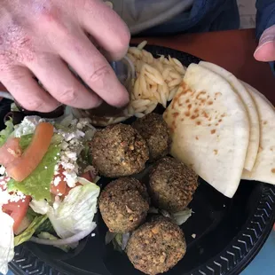 Falafel platter with orzo and small salad as his two sides