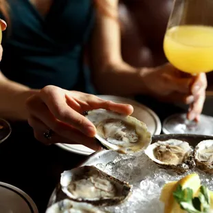 No weekend brunch is complete without mimosas and shareable plates like Repeal&apos;s fresh Oysters Rockefeller.