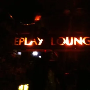 a neon sign in the dark