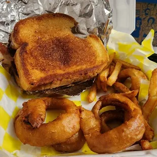 a grilled cheese sandwich and onion rings