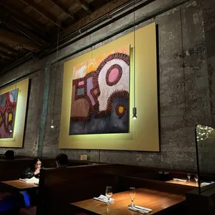 a woman sitting at a table in a restaurant