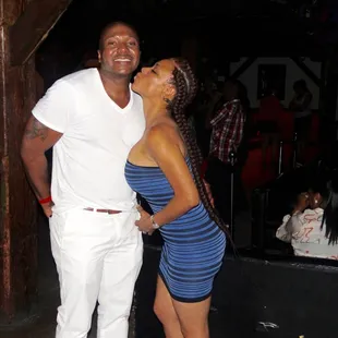 a man and a woman kissing