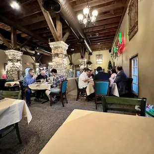 a restaurant with people sitting at tables