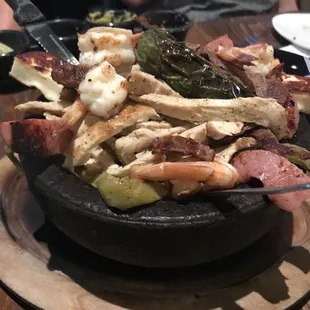 This sizzling bowl of meat and shrimp was yummy.  Be sure to get the tortillas nopal and cucumber margarita!