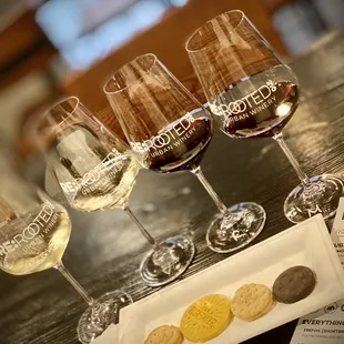 a row of wine glasses on a table