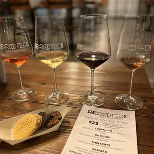 three glasses of wine and a cookie