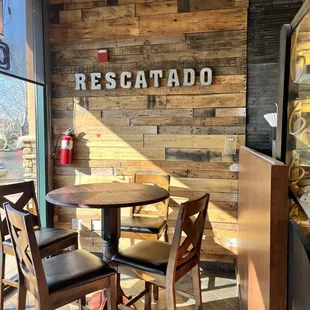 a table and chairs in a coffee shop