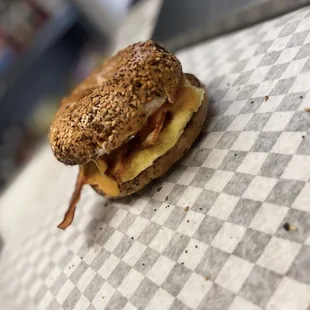 Hand crafted breakfast sandwiches! Egg, bacon, cheddar with cream cheese on a toasted everything bagel!