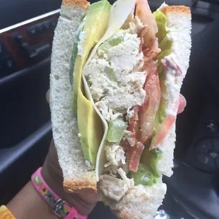 Chicken salad sandwich with bacon, avocado and provolone added