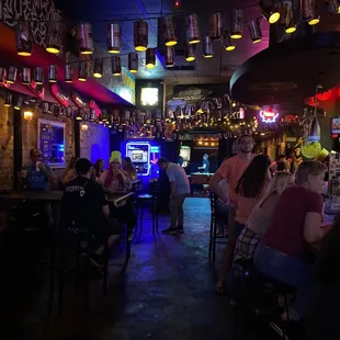 a group of people sitting at a bar
