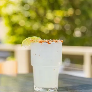 a margarita with a lime slice on the rim