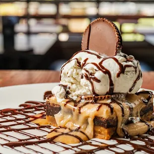 a dessert with ice cream and chocolate sauce