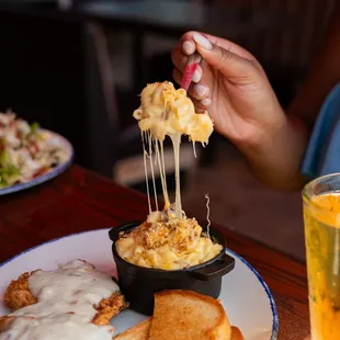a plate of food and a glass of beer