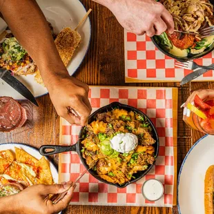 a group of people eating food at a table