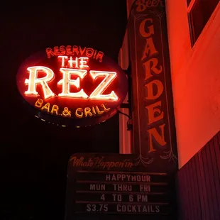 the neon sign for the rez bar and grill