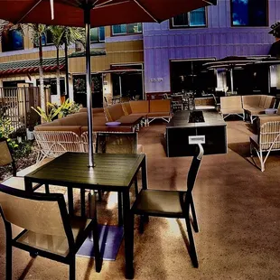 Plenty of seating outside, where they&apos;ll provide you with plastic cups if you want to enjoy the breeze. Oh, and a fire pit after dark!